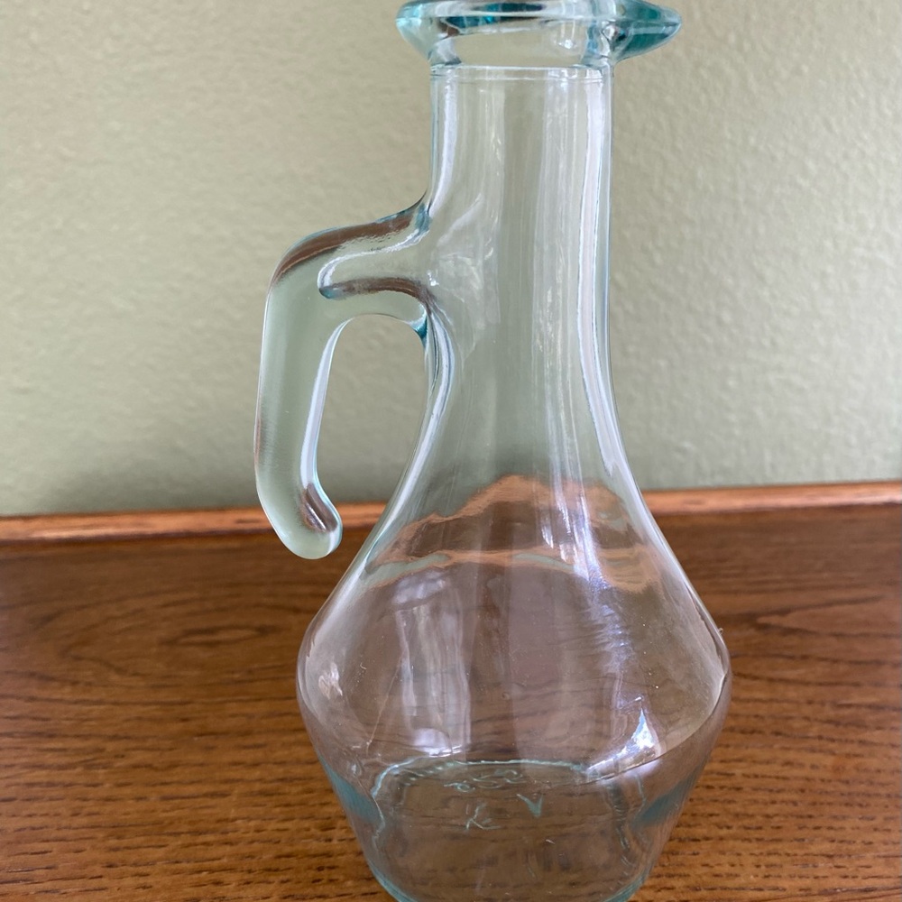Vintage aqua tint glass cruet with a handle.